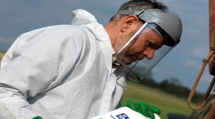 Farmer putting Yaravita into a spreader for production 